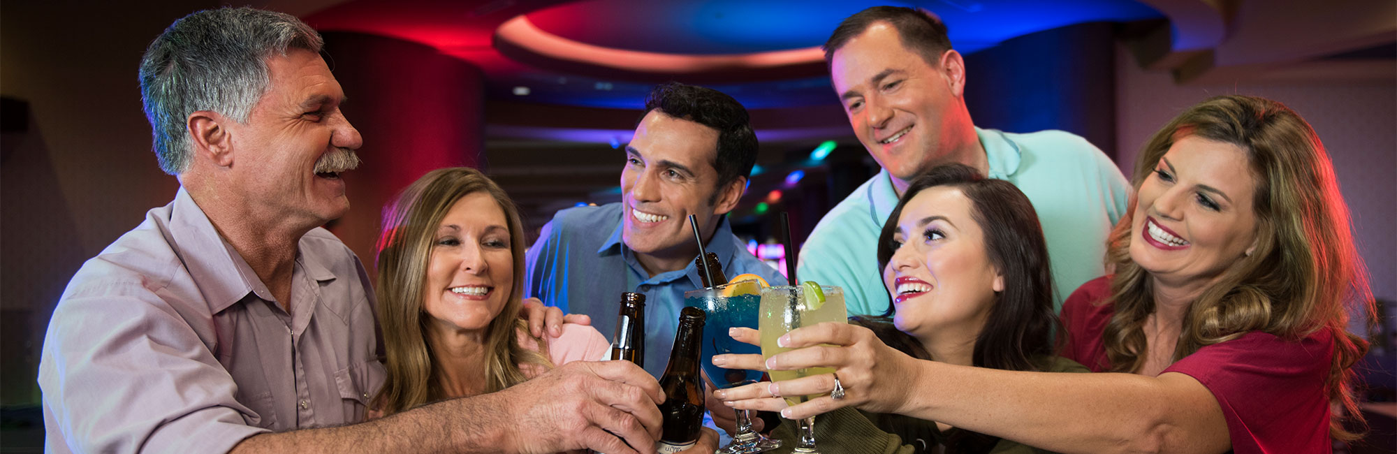 Friends toasting at the bar
